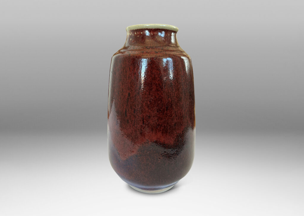 Gallery BAC large ovoid form with straight, upwardly-tapered sides and wide mouth, glazed in a deep burgundy oxblood with pale gray accents