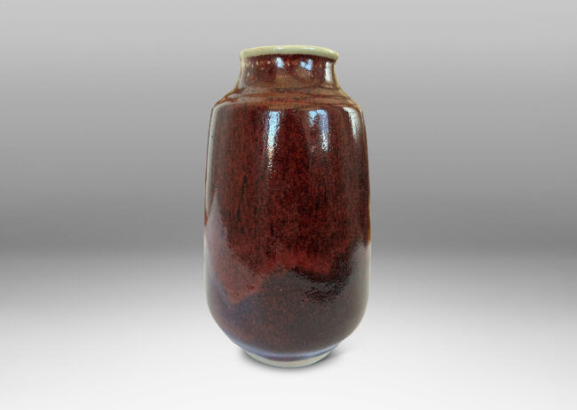 Gallery BAC large ovoid form with straight, upwardly-tapered sides and wide mouth, glazed in a deep burgundy oxblood with pale gray accents