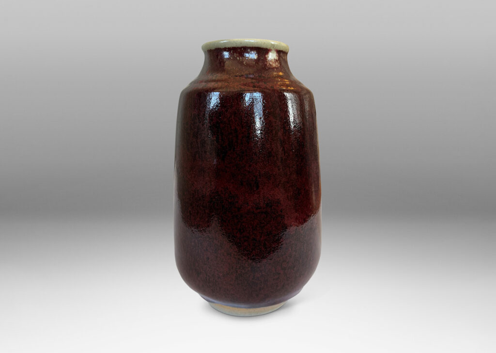 Gallery BAC large ovoid form with straight, upwardly-tapered sides and wide mouth, glazed in a deep burgundy oxblood with pale gray accents