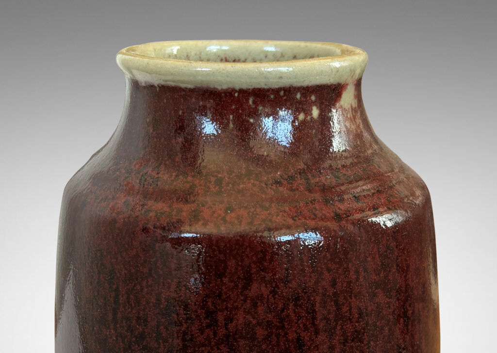 Gallery BAC large ovoid form with straight, upwardly-tapered sides and wide mouth, glazed in a deep burgundy oxblood with pale gray accents