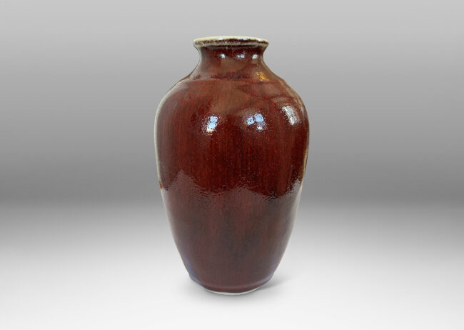 Gallery BAC apered form glazed in a deep burgundy oxblood with pale gray accents