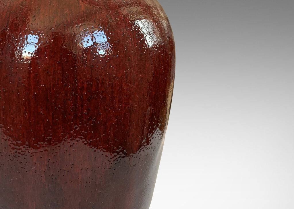 Gallery BAC apered form glazed in a deep burgundy oxblood with pale gray accents