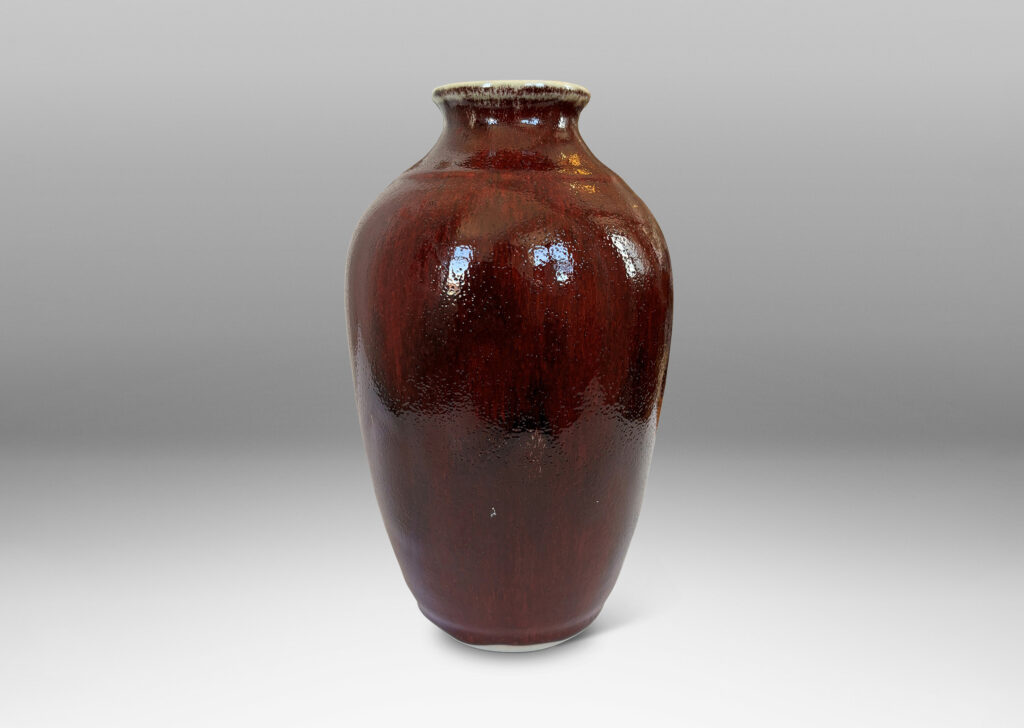 Gallery BAC apered form glazed in a deep burgundy oxblood with pale gray accents