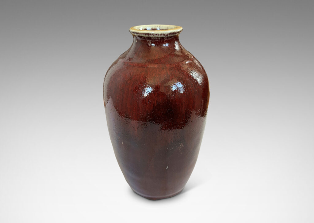 Gallery BAC apered form glazed in a deep burgundy oxblood with pale gray accents