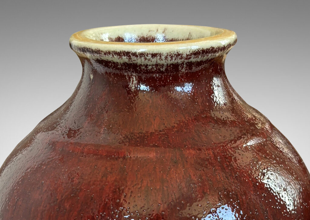 Gallery BAC apered form glazed in a deep burgundy oxblood with pale gray accents
