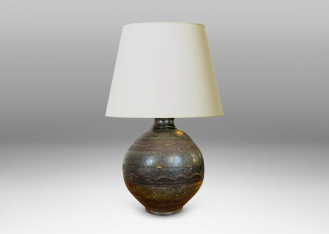 Gallery BAC spherical form ornamented with black horizontal bands decorated with sgraffito waves, overglazed in a flowing moody green