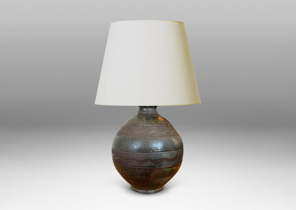Gallery BAC spherical form ornamented with black horizontal bands decorated with sgraffito waves, overglazed in a flowing moody green