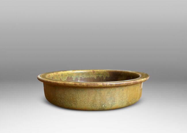 Gallery BAC flat bottom and upright sides with flange lip, glazed in a marvelous mottled warm brown with flowing mustard tone highlights around rim