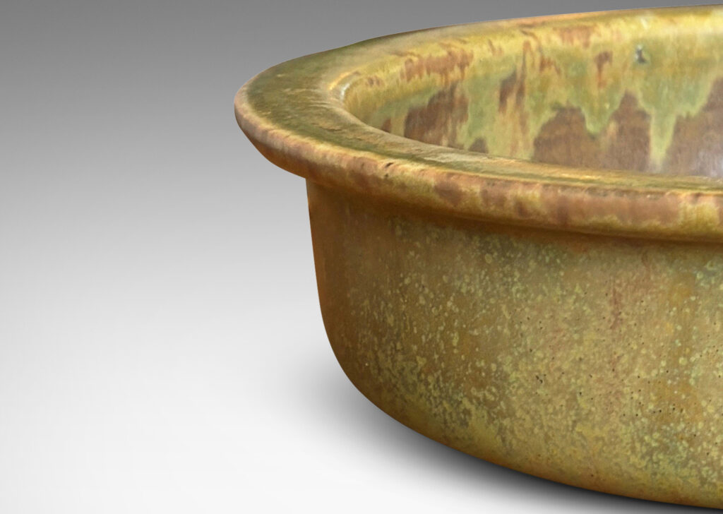 Gallery BAC flat bottom and upright sides with flange lip, glazed in a marvelous mottled warm brown with flowing mustard tone highlights around rim