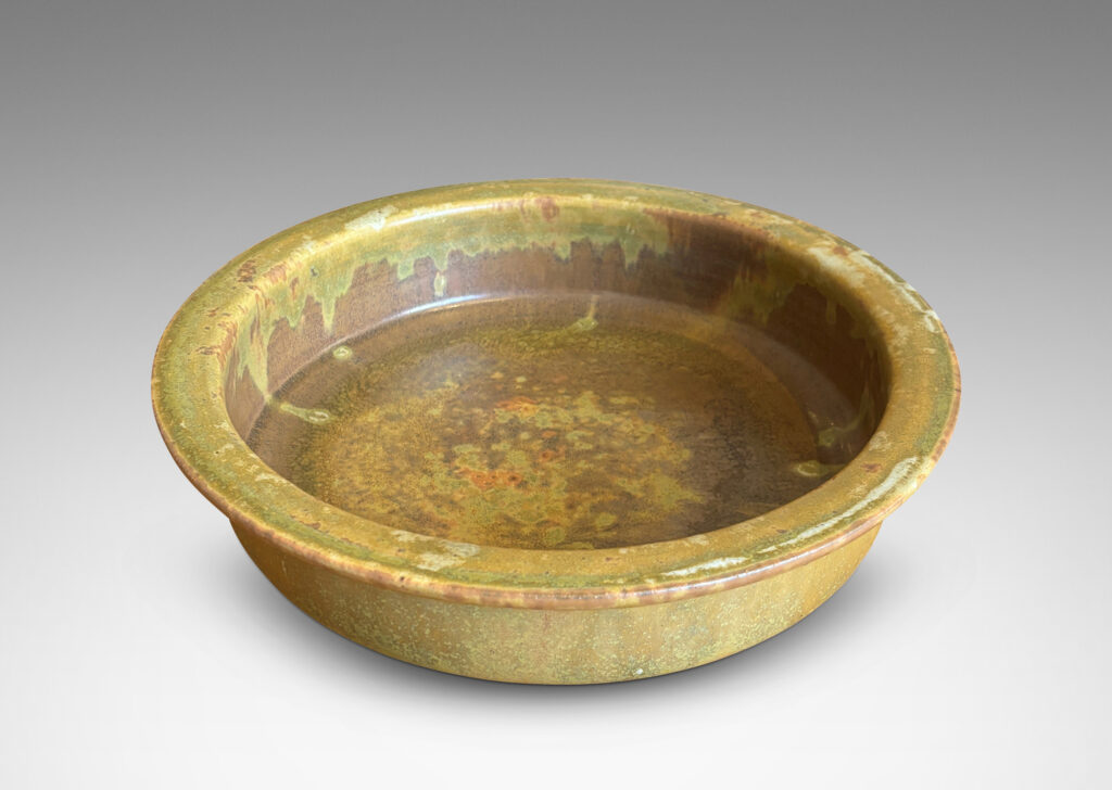 Gallery BAC flat bottom and upright sides with flange lip, glazed in a marvelous mottled warm brown with flowing mustard tone highlights around rim