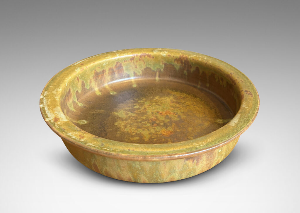 Gallery BAC flat bottom and upright sides with flange lip, glazed in a marvelous mottled warm brown with flowing mustard tone highlights around rim