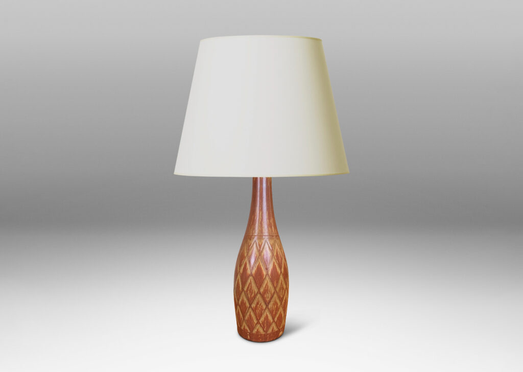 Gallery BAC tall bottle forms with carved diamond pattern, and glazed in terra-cotta/tan