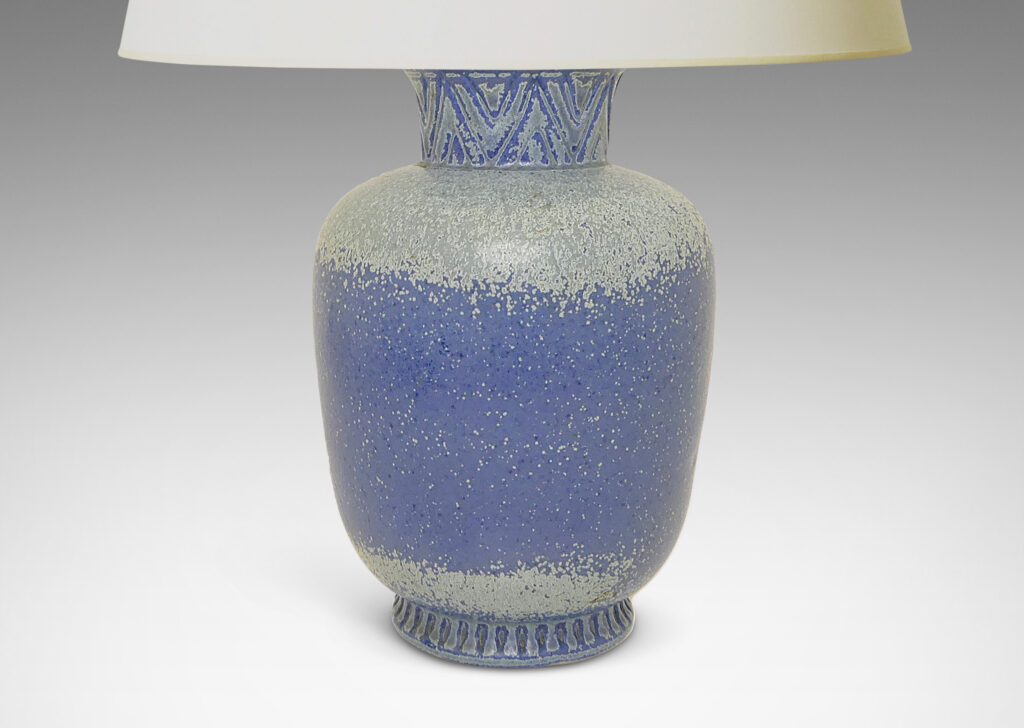 Gallery BAC tapered form with flared neck ornamented with a carved Egyptian style chevron pattern, glazed in French and pale blue tones