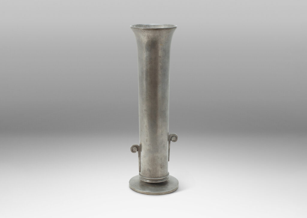 Gallery BAC tall cylindrical form with flared mouth, staggered scroll handles, and disk base; cast pewter