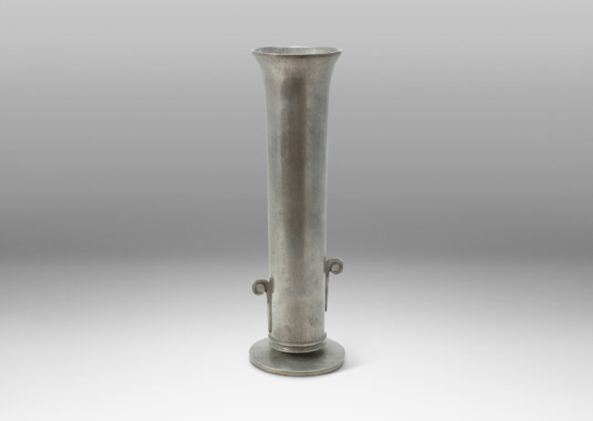 Gallery BAC tall cylindrical form with flared mouth, staggered scroll handles, and disk base; cast pewter