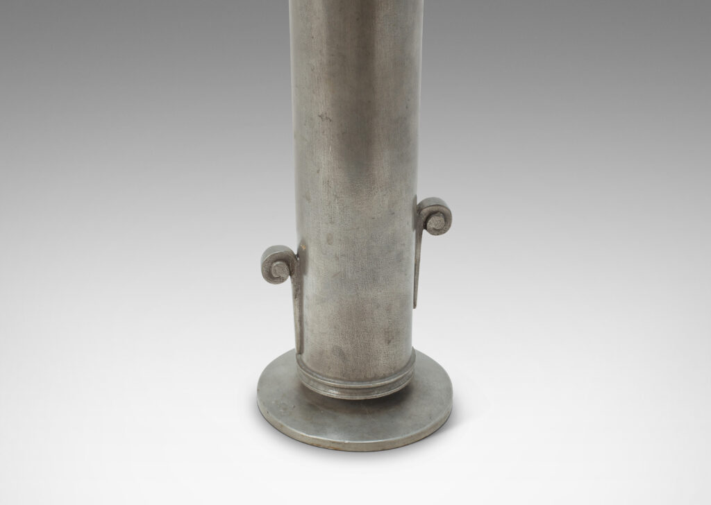 Gallery BAC tall cylindrical form with flared mouth, staggered scroll handles, and disk base; cast pewter