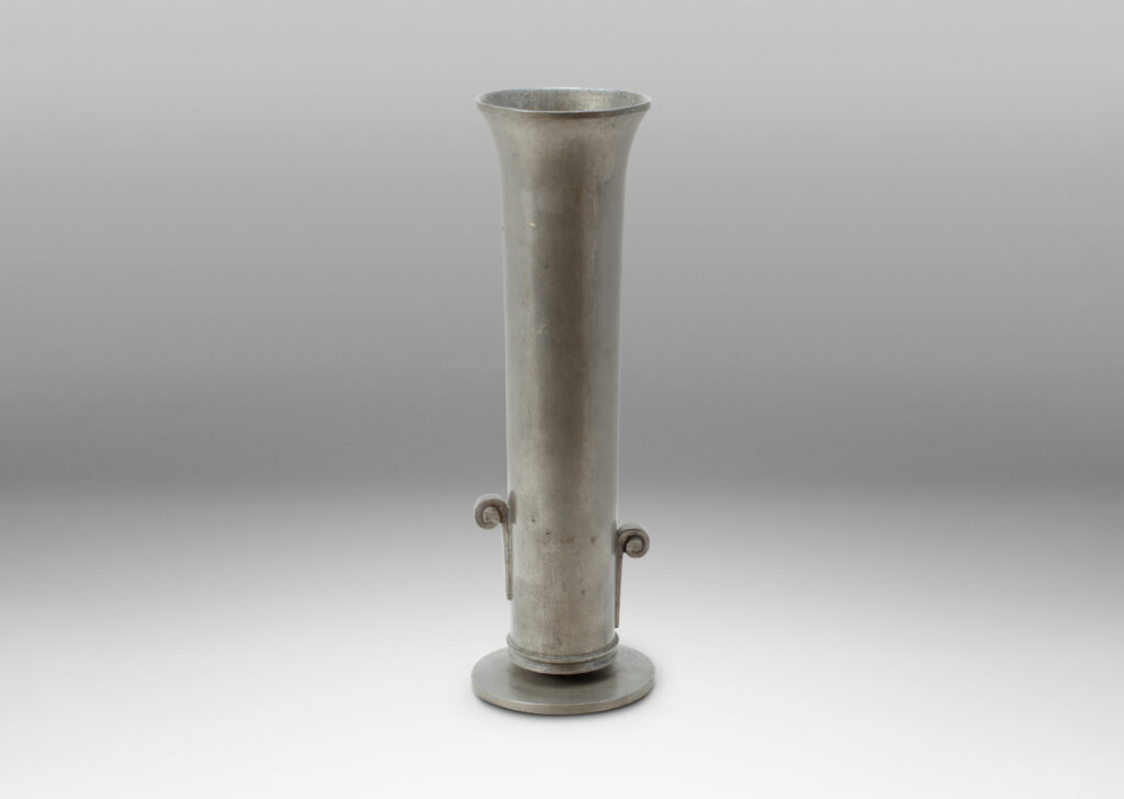 Gallery BAC tall cylindrical form with flared mouth, staggered scroll handles, and disk base; cast pewter