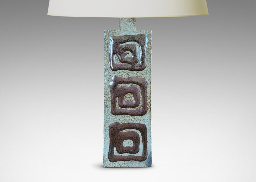 Gallery BAC two floating rectangular planes connected by a central pillar, glazed in dappled gray-brown with concentric square motifs in red luster
