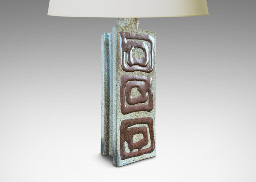 Gallery BAC two floating rectangular planes connected by a central pillar, glazed in dappled gray-brown with concentric square motifs in red luster