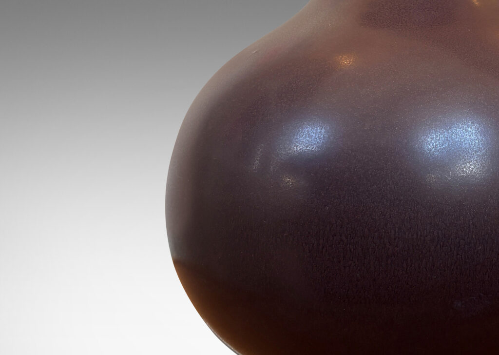 Gallery BAC plump bulbous form glazed in an eggshell finish ganache brown with gilded accent bands