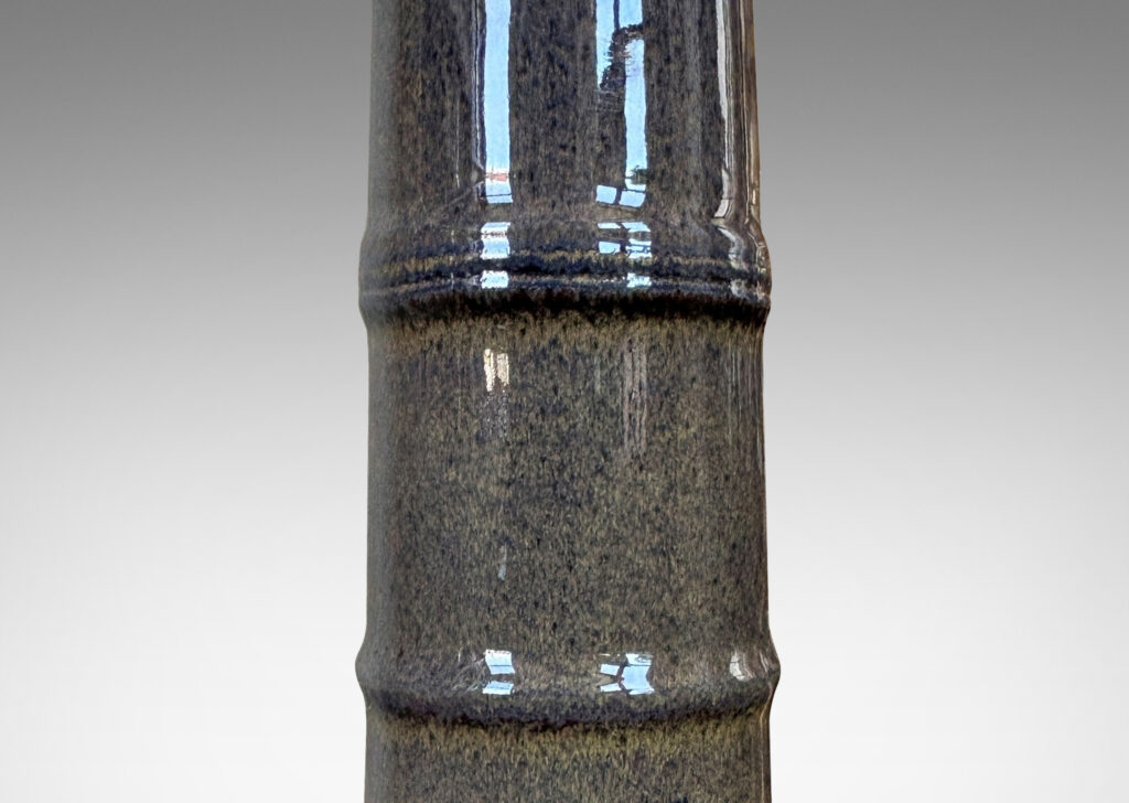 Gallery BAC cylindrical form with bamboo nodule-like rings, glazed in dark blue with brown undertones