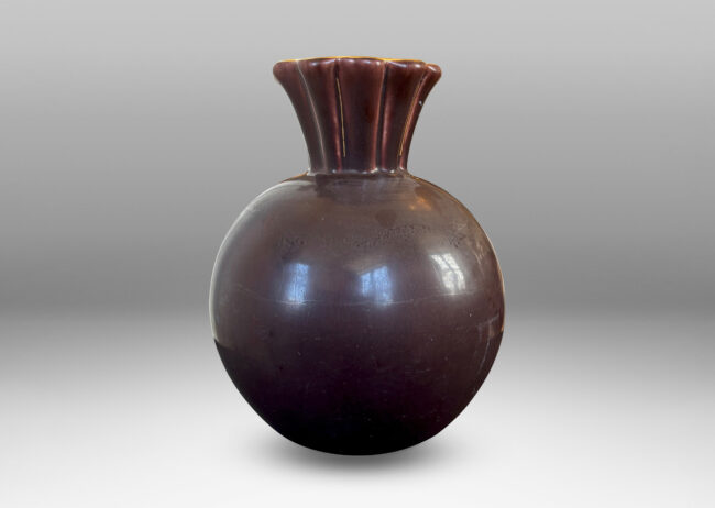 Gallery BAC globe form with issuing frilled trumpet mouth, glazed in a deep ganache brown with gilded outline to lip