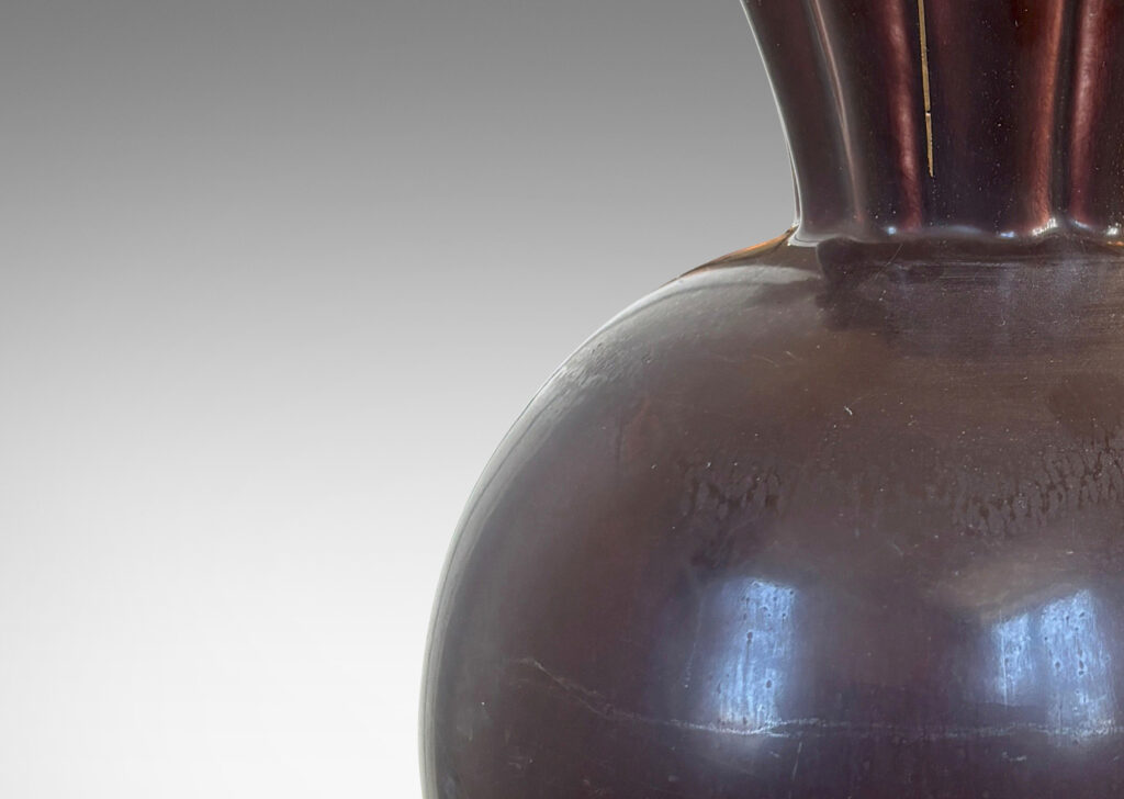 Gallery BAC globe form with issuing frilled trumpet mouth, glazed in a deep ganache brown with gilded outline to lip