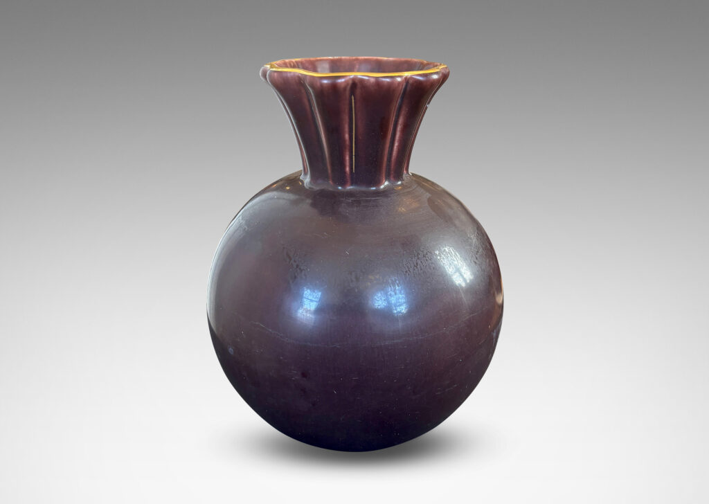 Gallery BAC globe form with issuing frilled trumpet mouth, glazed in a deep ganache brown with gilded outline to lip