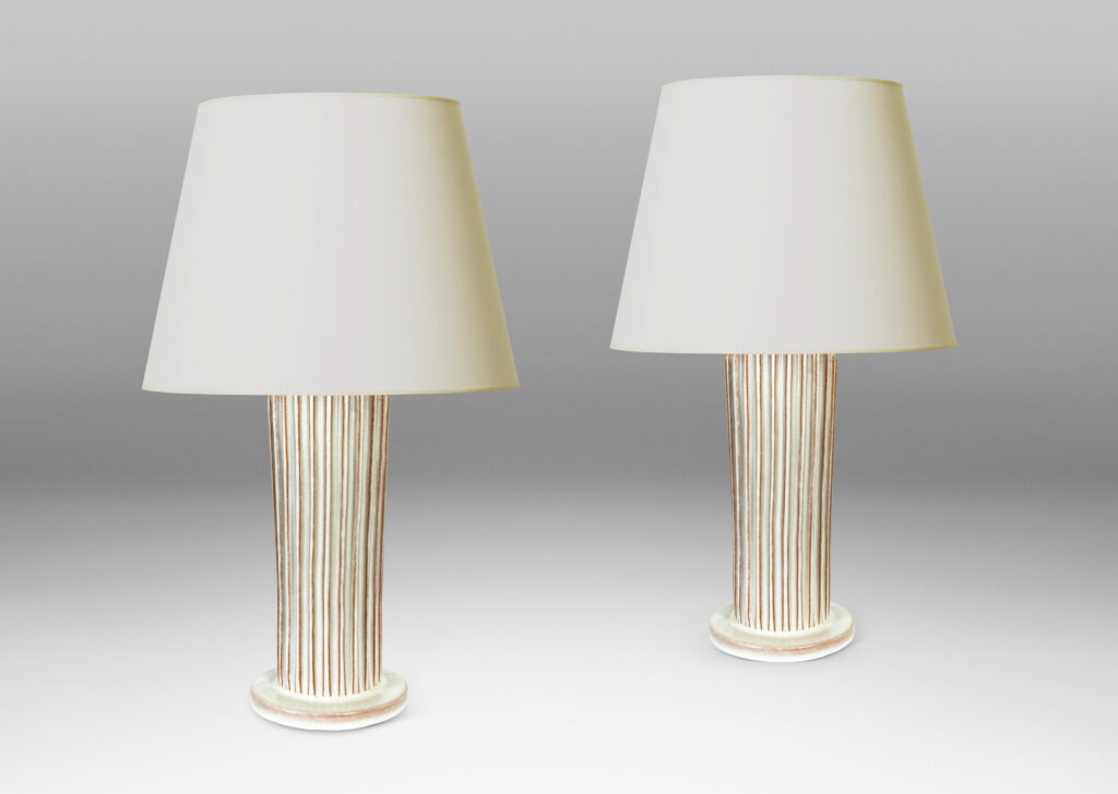 Gallery BAC tapered fluted forms on disks in a white glaze