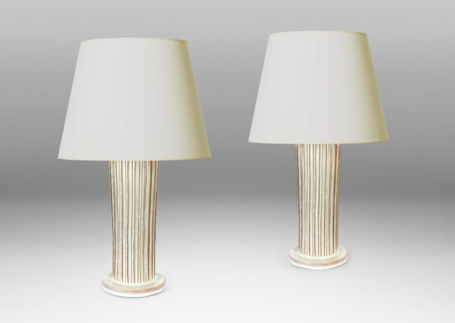 Gallery BAC tapered fluted forms on disks in a white glaze