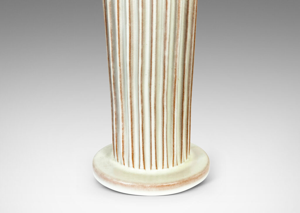 Gallery BAC tapered fluted forms on disks in a white glaze