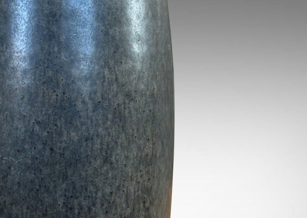 Gallery BAC tall swelling form with carved diamond pattern at top, glazed in dark gray and black