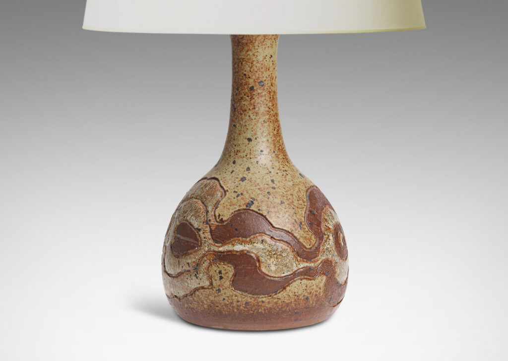 Gallery BAC plump globe form with tall attenuated neck, encircled in a textured relief of organic form, glazed in brown and gauzy white against brown spotted pale gray