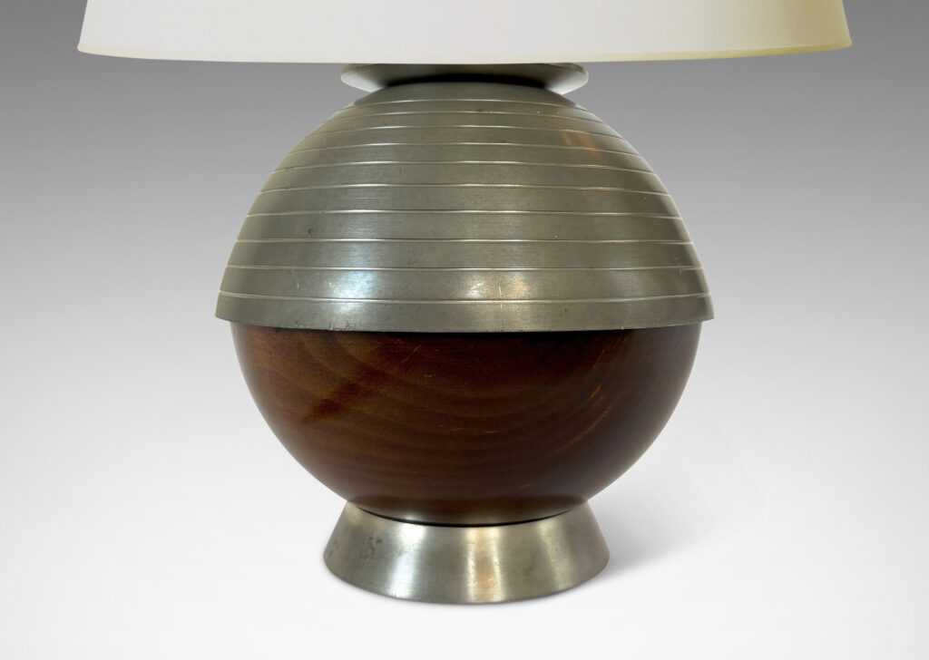 Gallery BAC globe form, with ringed top hemisphere and flanged base in pewter with wood lower hemisphere