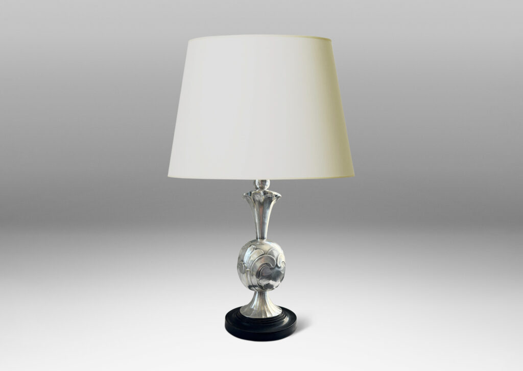 Gallery BAC ovoid form with bold acanthus leaf pattern reliefs, with trumpeting foot and neck, mounted on a stepped disk plinth