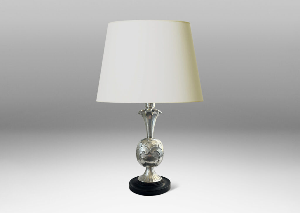 Gallery BAC ovoid form with bold acanthus leaf pattern reliefs, with trumpeting foot and neck, mounted on a stepped disk plinth