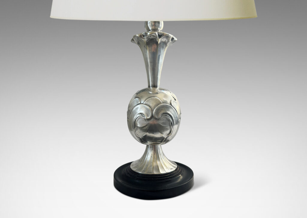 Gallery BAC ovoid form with bold acanthus leaf pattern reliefs, with trumpeting foot and neck, mounted on a stepped disk plinth
