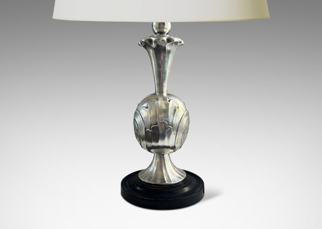 Gallery BAC ovoid form with bold acanthus leaf pattern reliefs, with trumpeting foot and neck, mounted on a stepped disk plinth