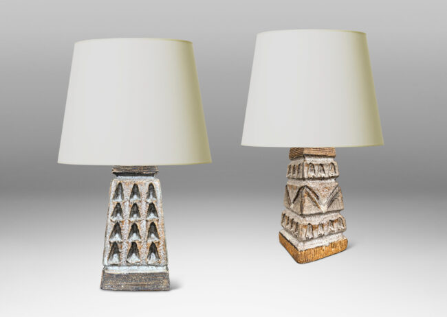 Gallery BAC square tapered obelisk-like forms with carved patterns of triangle motifs, glazed in running pale gray and matte brown