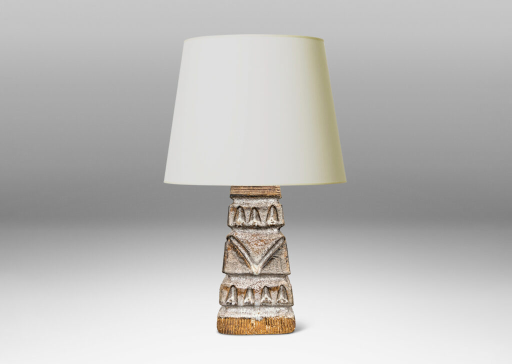 Gallery BAC square tapered obelisk-like forms with carved patterns of triangle motifs, glazed in running pale gray and matte brown