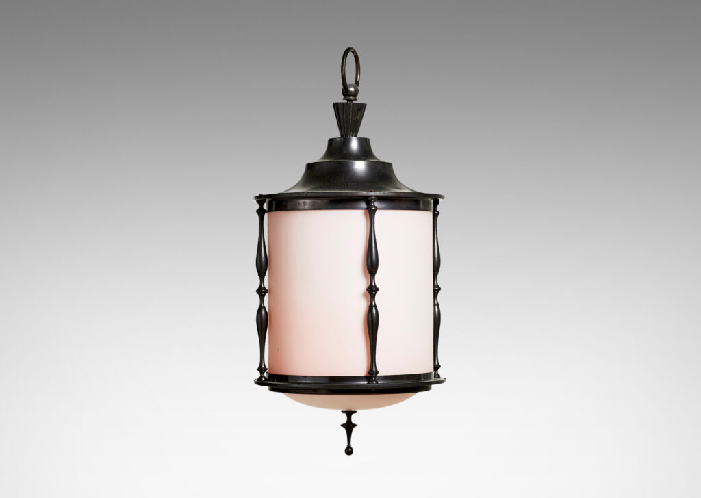 Gallery BAC cylindrical form with stepped top, slender turned brackets and hand-crafted chain patinated in a dark bronze tone