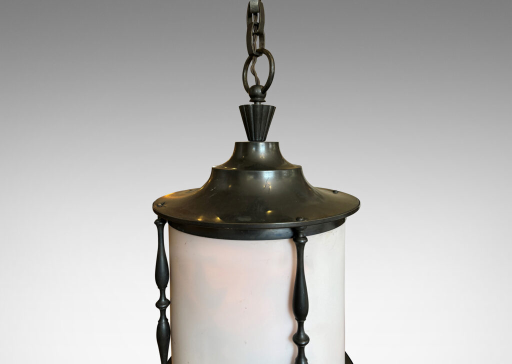 Gallery BAC cylindrical form with stepped top, slender turned brackets and hand-crafted chain patinated in a dark bronze tone