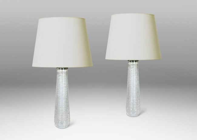 Gallery BAC tall tapered forms finished in an organic thin striae texture; crystal