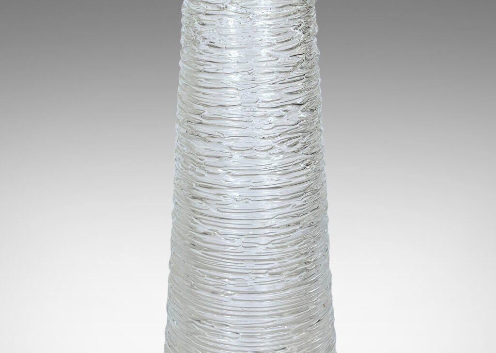 Gallery BAC tall tapered forms finished in an organic thin striae texture; crystal