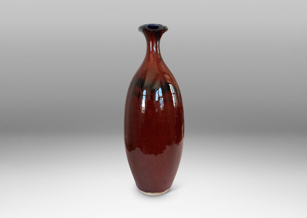Gallery BAC tall sinuously modeled form in a gloss burgundy oxblood glaze