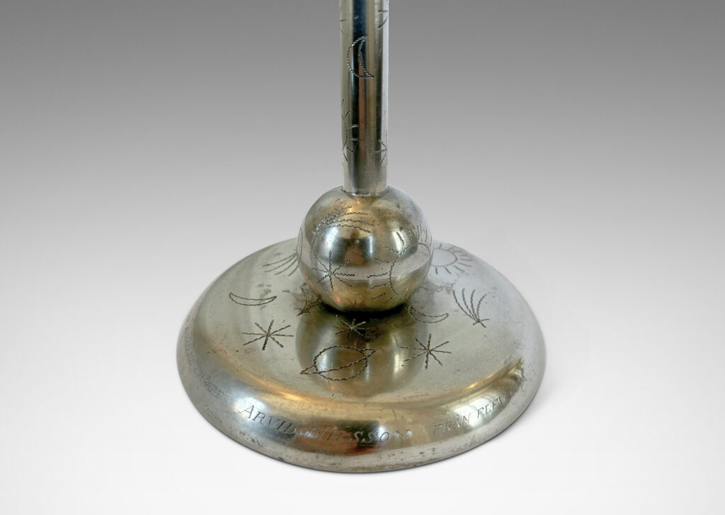 Gallery BAC stand on a ball and disk plinth, playfully engraved with stars, suns and moons