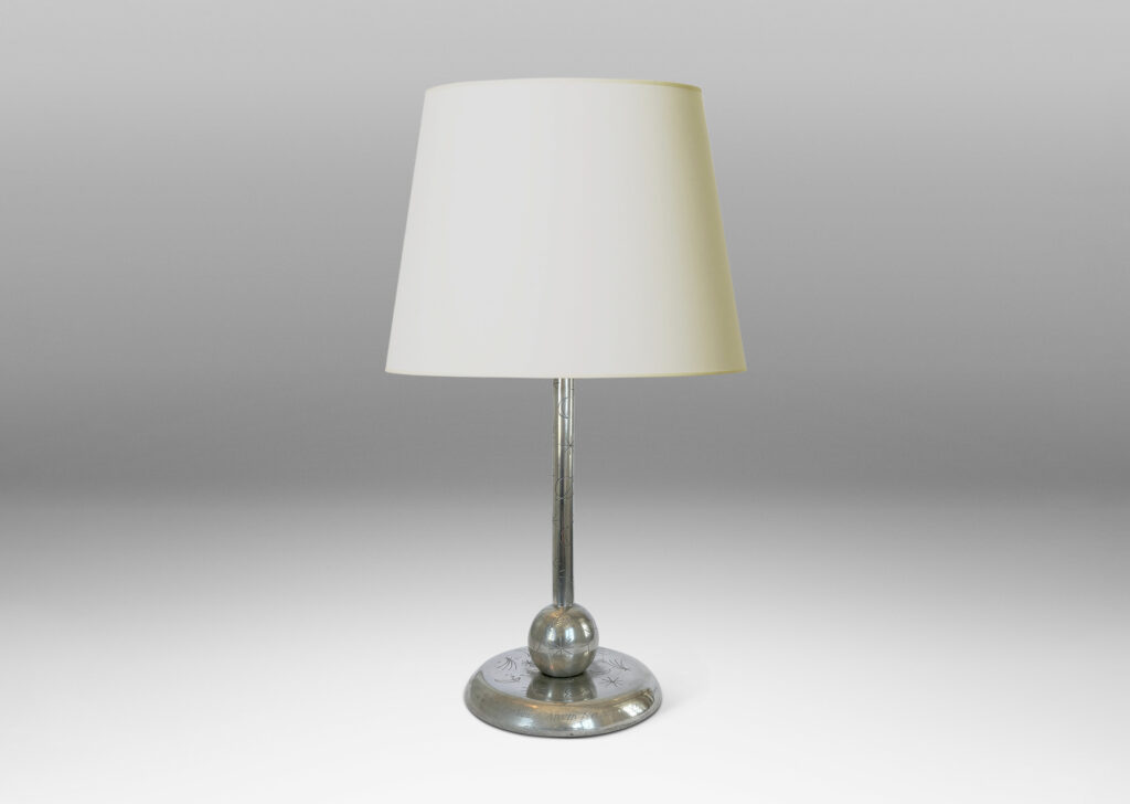 Gallery BAC stand on a ball and disk plinth, playfully engraved with stars, suns and moons