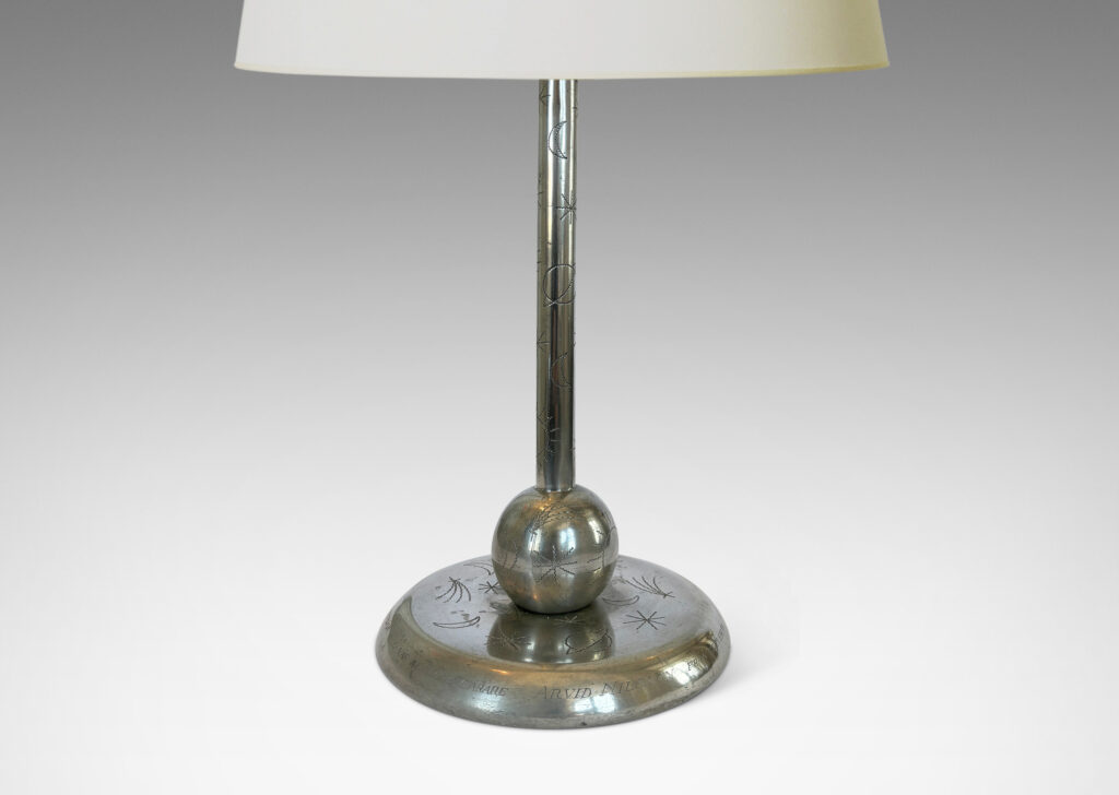 Gallery BAC stand on a ball and disk plinth, playfully engraved with stars, suns and moons