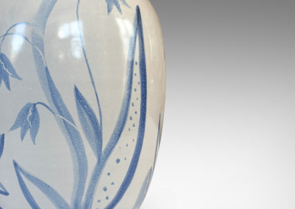 Gallery BAC ovoid form glazed in white with folk-style floral designs in light blue tones