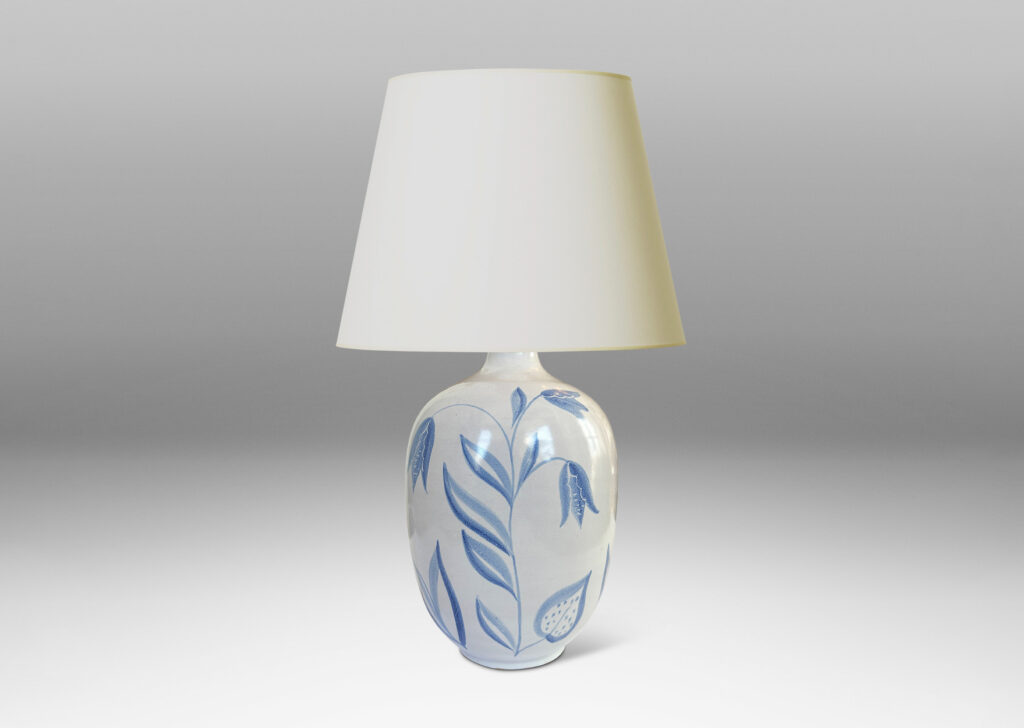 Gallery BAC ovoid form glazed in white with folk-style floral designs in light blue tones